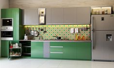 a kitchen with green cabinets and silver appliances