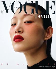 a woman with red lipstick on the cover of a magazine