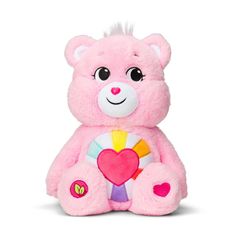 a pink teddy bear holding a candy heart