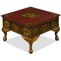 an ornately decorated coffee table with drawers