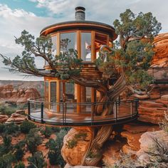 a tree house built into the side of a cliff