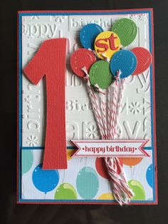 a birthday card with balloons and a number one on it