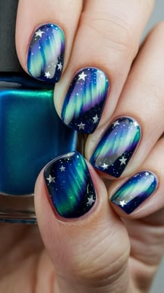 Check out this article if you want Aurora nail art that combines the Northern Lights with a starry Arctic sky. These designs add depth with shimmering stars and tiny comet streaks, giving your nails a magical, wintry touch. Save this pin to recreate this look and bring the Arctic wonder to your nails! Northern Lights Nails, Night Nail Art, Nail Art Ideas For Winter, Sky Nail Art, Aurora Nail Art, Lights Nails, Nail Painting Ideas, Winter Nail Inspiration, Nails Guide