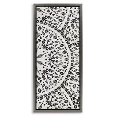 an intricately designed paper cutting board with black and white designs on the edges,