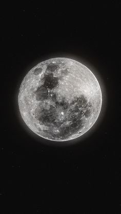 the full moon is seen in black and white