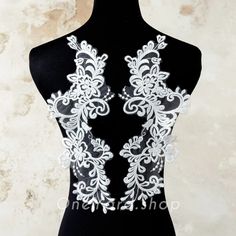 the back of a mannequin with white lace on it