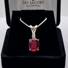 Beautiful Ruby & White Sapphire Pendant Necklace * 3ct Oval Cut Ruby measures 10mm x 8mm * Single Brilliant Cut White Sapphire Accent * 16" or 18" Sterling Silver Chain Included * Solid Sterling Silver (Also available in 14k Yellow or White Gold - message me for pricing & handling times) Hallmarked & Gift Ready! Matching Earrings & Ring Available! This 3ct Ruby is laboratory grown. It is identical to the genuine stone in every way, including chemistry, composition and hardness, with an outstandi Valentine Gift For Wife, Sapphire Necklace Pendants, Fine Art Jewelry, Ruby Necklace, Sapphire Pendant, Sterling Silver Necklace Pendants, Diamond Pendant Necklace, Valentine Gift, Gold Pendant Necklace