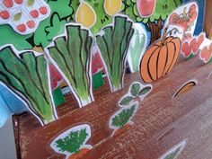 a wooden bench decorated with vegetables and fruits