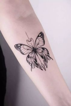 a black and white butterfly tattoo on the right arm, it looks like something out of a fairy tale