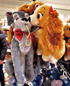 several stuffed animals are on display in a store