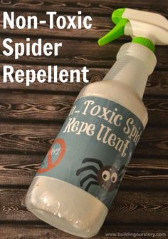 a bottle of spider repellent sitting on top of a wooden table