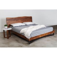 The Bent collection puts nature’s craft front and center. Made of beautiful solid acacia wood, rustic live edge detailing shows off the unique knots and whorls of the wood. An organic element for your bedroom, the Bent king bed’s expansive live edge headboard is a showcase for the acacia. A bent iron piece adds an industrial juxtaposition to the natural elements. Pair with other pieces in the Bent collection for a complete look.","Bent King Size Bed. Solid Acacia wood with a natural, water-based Live Edge Headboard, Live Edge Bed, Lit King Size, King Platform Bed, Queen Platform Bed, King Bed Frame, Wood Bed Frame, Wooden Bed Frames, Wood Rustic