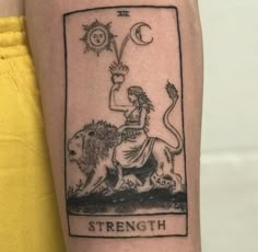 a tattoo on the arm of a woman with a lion and sun above her head