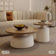 a living room filled with furniture and a bowl of fruit on top of a table