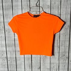 Orange Crop Size 6 Orange Short Sleeve Crop Top, Orange Stretch Crop Top With Short Sleeves, Trendy Orange Short Sleeve Crop Top, Fitted Orange Trendy T-shirt, Trendy Fitted Orange T-shirt, Basic Orange T-shirt For Spring, Basic Orange Tops For Summer, Fitted Orange T-shirt For Spring, Orange Ruffle Top