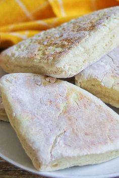 three pieces of bread on a white plate