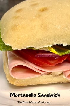 The classic Italian sandwich is piled high with classic mortadella & veggies. This cold cut hero sandwich on a foccacia is an easy lunch, dinner, or party entree. Best recipe for workday, school, camping, hiking, beach days, or picnics. Sandwich Mortadella, Cold Cut Sandwich, Party Entrees, Lunch Summer, Hero Sandwich