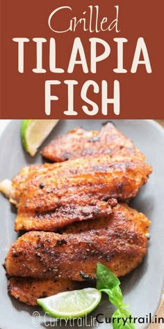 grilled tilapia fish on a plate with limes