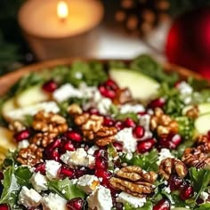 a salad with apples, cheese and walnuts in a wooden bowl on a table