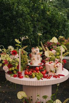 a table topped with lots of different types of cakes and desserts on top of it