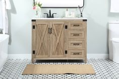 Reminiscent of barn doors, the two door cabinet and four drawers adds both stylistic charm and function with its plethora of storage options for all your bathroom essentials. Whether for your bathroom or the guests', everyone will marvel at its classic look for traditional and farmhouse aesthetics. A slab of engineered marble rounds out the piece up top, as well as the porcelain under mount sink and predrilled faucet holes. This vanity arrives fully assembled. Elegant Decor Home Furnishing 42-in Natural Oak Undermount Single Sink Bathroom Vanity with Ivory White Engineered Marble Top in Yellow | HF270726NT Two Door Cabinet, Single Sink Bathroom, Sink Bathroom Vanity, Single Sink Bathroom Vanity, Bathroom Vanity Tops, Sink Bathroom, Door Cabinet, Single Sink, Bathroom Essentials