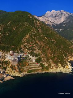 an aerial view of a small town on the side of a mountain