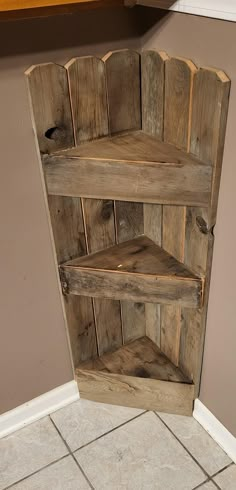 a shelf made out of wooden planks on the floor