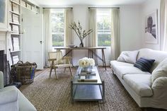 a living room filled with furniture and a fire place