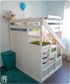 bunk bed with stairs and storage drawers in children's playroom or bedroom area