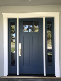 a blue front door with two sidelights