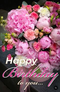 a bouquet of pink flowers with the words happy birthday to you