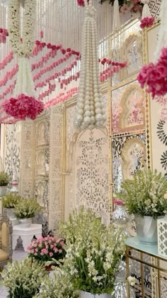 a room filled with lots of pink and white flowers