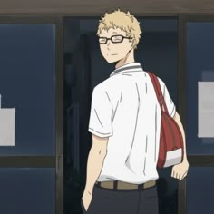 a man with glasses and a backpack standing in front of a building that says, i don't know what this guy is