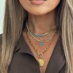 This turquoise bead necklace features a delicate cross charm, blending faith with vibrant style. From our Eternal Skies collection, it’s a meaningful piece perfect for layering or wearing solo. A timeless symbol, this necklace makes a thoughtful gift for any occasion. Material: 14K Gold Plated BrassStones: Turquoise ResinStone Size: 3.5mmLength: Adjustable up to 12" - 16" Turquoise Cross Necklace, Turquoise Necklaces, Turquoise Resin, Sky Collection, Vibrant Style, Timeless Symbol, Turquoise Cross, Turquoise Bead Necklaces, Custom Initials