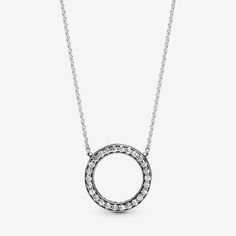 Bring your outfit full circle with this sparkling necklace crafted in sterling silver. The reversible pendant is framed with shimmering stones on one side, and embossed with the Pandora logo on the reverse – enabling you to create two different looks. For extra versatility, the delicate chain is adjustable to three different lengths. Pair this circle necklace with the matching Circle of Sparkle Earrings for maximum glamor. - Pandora Circle of Sparkle Necklace - Sterling silver / Cubic Zirconia / Clear - Sz. 17.7 in Silver Cubic Zirconia Round Heart Necklace, Pandora Circle Necklace, Modern Silver Sphere Necklace, Elegant Nickel-free Crystal Necklace With Round Pendant, Nickel-free Sterling Silver Circle Necklaces, Pandora Logo, Sparkle Necklace, Necklace Clasps, Necklace Craft