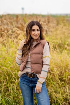 This simple vest is perfect for colder weather. Adding a vest is a quick and easy way to take your outfit to the next level of stylish! Whether you pair with a blouse, sweater, graphic crewneck, button up, or just a basic long sleeve tee, we know this will be a staple piece in your wardrobe!Shell, Lining, & Fill: 100% Polyester Machine wash cold with like colors. Line dry. Everyday Fall Turtleneck Outerwear, Trendy Winter Vest For Everyday Wear, Sleeveless Vest For Cold Weather In Fall, Fall Crew Neck Vest, Trendy Winter Sweater Vest For Layering, Trendy Sweater Vest For Winter Layering, Trendy Sweater Vest For Fall Layering, Chic Brown Winter Vest, Fall Sweater Vest For Layering