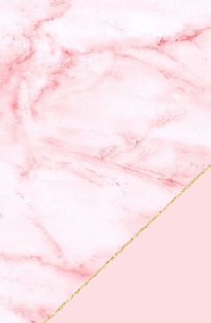 a pink marble background with the word dream written in gold on it and an arrow