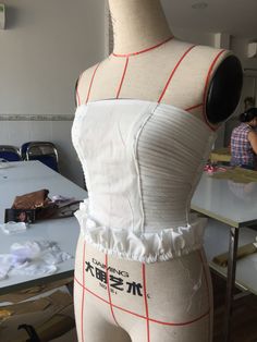 the mannequin is being worked on with fabric