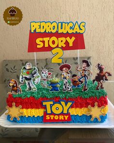 a toy story birthday cake on a table