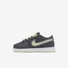 See what's lurking behind the shadows in these dark and ghostly Dunk Lows. Durable leather pairs with a slime green outsole so little feet have comfort and traction, while glow-in-the-dark details add style that feels more like a treat than a trick. Nike Green Skate Shoes With Contrast Sole, Gray Low-top Sneakers With Soft Sole, Dunk Lows, Dunks Nike, Nike Dunk Low, The Shadows, Dunk Low, Nike Dunk, Nike Dunks