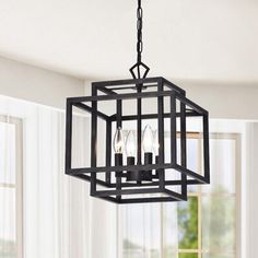 a black chandelier hanging from a ceiling