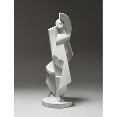 a white sculpture sitting on top of a table