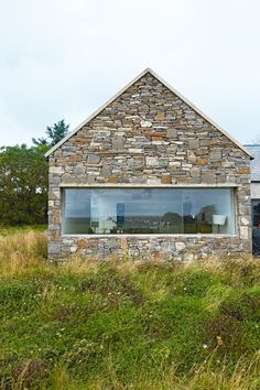 an image of a house made out of rocks