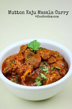 a white bowl filled with meat and vegetables