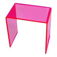 a pink plastic table on a white background