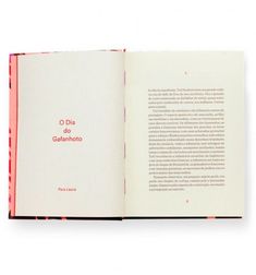 an open book with red lettering on the front and back cover is shown in spanish