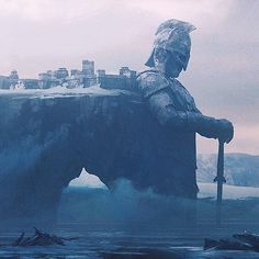 the giant statue is surrounded by water and mountains, with people standing on it's sides