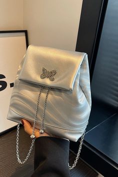 This Butterfly Backpack is a cute everyday accessory. Featuring a butterfly detail and silver hardware, you can go anywhere in style. The medium size and chain straps make it effortlessly chic for day to night. Butterfly Backpack, Change Of Address, Everyday Accessories, A Butterfly, Effortlessly Chic, Silver Hardware, Chain Strap, Medium Size, Sale Items