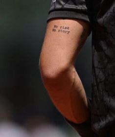 a close up of a person's arm with the words no flesh, no glory written on it