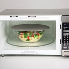 a microwave oven with a bowl in it